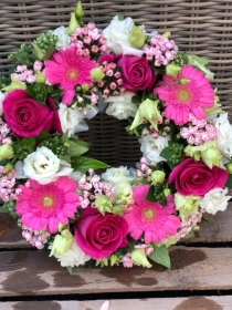 Pink wreath loose  stem tribute